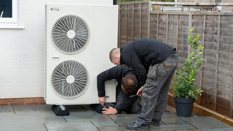 installers-fitting-an-air-source-heat-pump